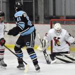 Kenai Central goalie Evyn Witt makes a save in front of Kenai Centrals Sawyer Vann and Chugiaks Morgan Greninger on Thursday, Nov. 14, 2024, at the Kenai Multi-Purpose Facility in Kenai, Alaska. (Photo by Jeff Helminiak/Peninsula Clarion)