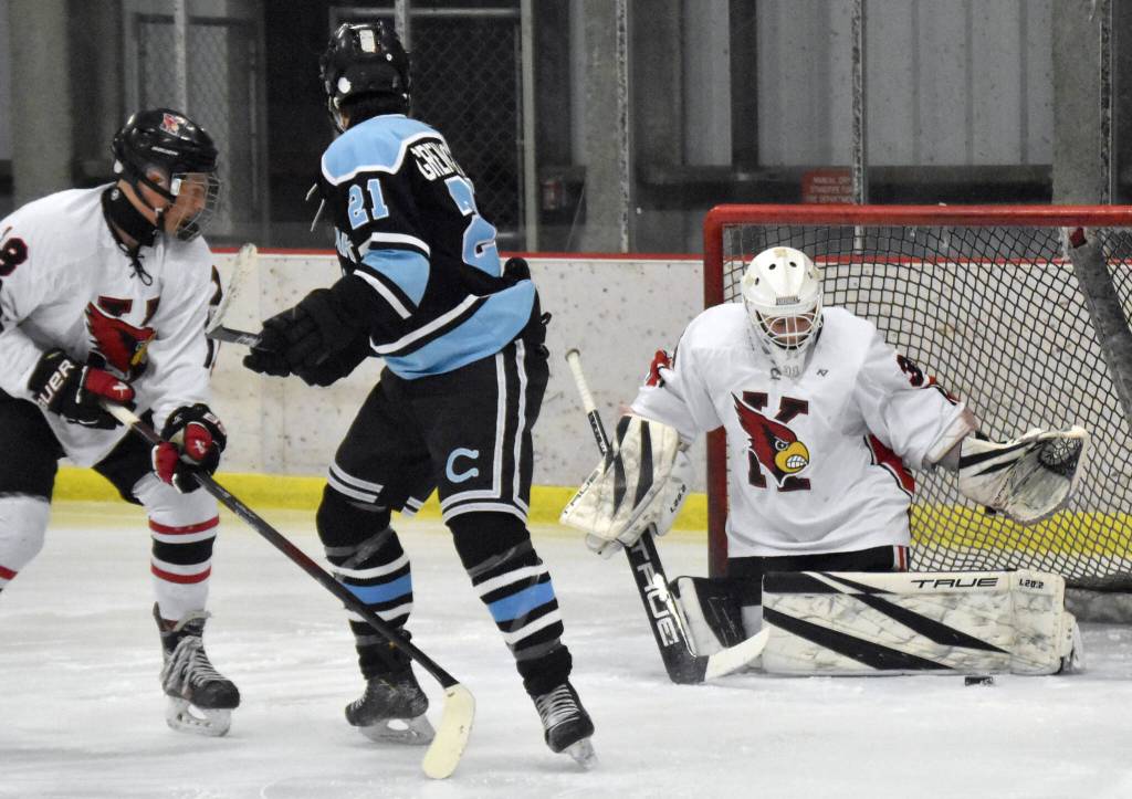 Kenai Central goalie Evyn Witt makes a save in front of Kenai Centrals Sawyer Vann and Chugiaks Morgan Greninger on Thursday, Nov. 14, 2024, at the Kenai Multi-Purpose Facility in Kenai, Alaska. (Photo by Jeff Helminiak/Peninsula Clarion)