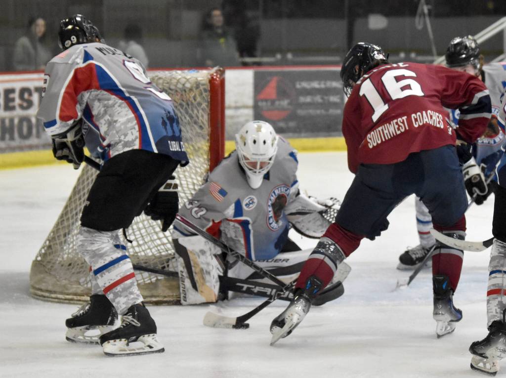 Kenai River Brown Bears goalie Owen Zenone makes a save on Luc Plante of the Fairbanks Ice Dogs on Friday, Nov. 15, 2024, at the Soldotna Regional Sports Complex in Soldotna, Alaska. (Photo by Jeff Helminiak/Peninsula Clarion)