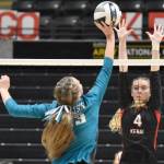 Kenai Centrals Avia Miller puts up a block on Nikiskis Mandee Roofe on Saturday, Nov. 16, 2024, in the Class 3A state volleyball championship at the Alaska Airlines Center in Anchorage, Alaska. (Photo by Jeff Helminiak/Peninsula Clarion)