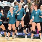 Nikiski players dance and look at the video scoreboard Saturday, Nov. 16, 2024, in the Class 3A state volleyball championship at the Alaska Airlines Center in Anchorage, Alaska. (Photo by Jeff Helminiak/Peninsula Clarion)