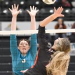 Nikiskis Ashlynne Playle puts up a block on Kenai Centrals Sophia Tapley on Saturday, Nov. 16, 2024, in the Class 3A state volleyball championship at the Alaska Airlines Center in Anchorage, Alaska. (Photo by Jeff Helminiak/Peninsula Clarion)