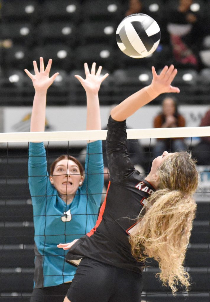 Nikiskis Ashlynne Playle puts up a block on Kenai Centrals Sophia Tapley on Saturday, Nov. 16, 2024, in the Class 3A state volleyball championship at the Alaska Airlines Center in Anchorage, Alaska. (Photo by Jeff Helminiak/Peninsula Clarion)