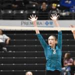 Kenai Centrals Stella Selanoff hits against Nikiskis Blakeley Jorgensen and Alexa Iyatunguk on Saturday, Nov. 16, 2024, in the Class 3A state volleyball championship at the Alaska Airlines Center in Anchorage, Alaska. (Photo by Jeff Helminiak/Peninsula Clarion)