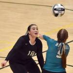 Nikiskis Kailey Stynsberg watches as Avery Ellis digs up a ball Saturday, Nov. 16, 2024, in the Class 3A state volleyball championship at the Alaska Airlines Center in Anchorage, Alaska. (Photo by Jeff Helminiak/Peninsula Clarion)
