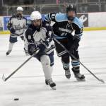 Soldotnas Riley Cronin carries the puck under pressure from Chugiaks Morgan Greninger on Friday, Nov. 15, 2024, at the Soldotna Regional Sports Complex in Soldotna, Alaska. (Photo by Jonas Oyoumick/Peninsula Clarion)
