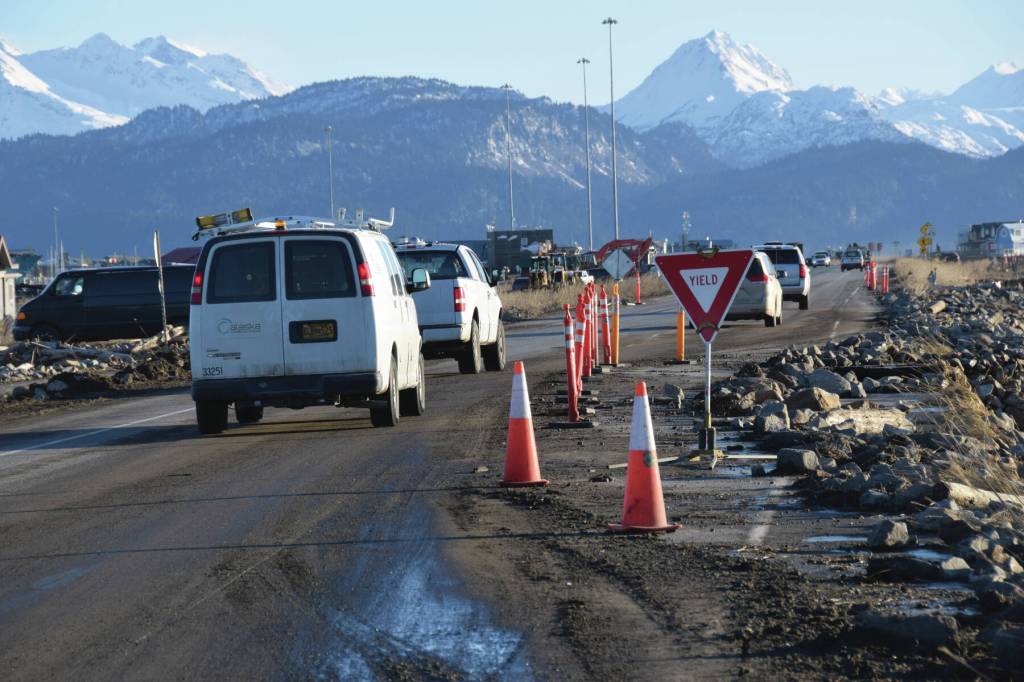 Cars yield to oncoming traffic before commuting south on the single open lane of Homer Spit Road on Monday, Nov. 18<ins>, 2024</ins>, following significant erosion damage to the highway that occurred on Saturday<ins> in Homer, Alaska</ins>. (Delcenia Cosman/Homer News)
