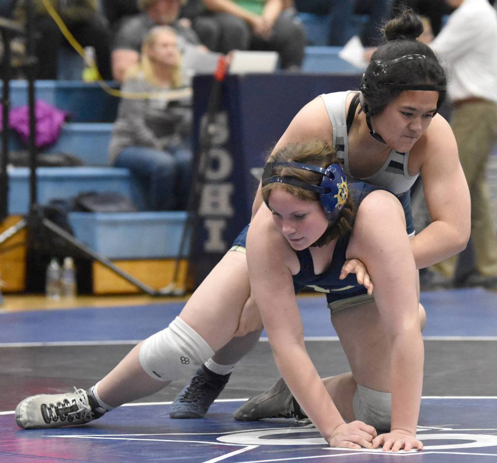 Infinity-Ann Asiata-Haga of Soldotna works her way to a pin of Homers Araya Andres on Tuesday, Nov. 19, 2024, at Soldotna High School in Soldotna, Alaska. (Photo by Jeff Helminiak/Peninsula Clarion)