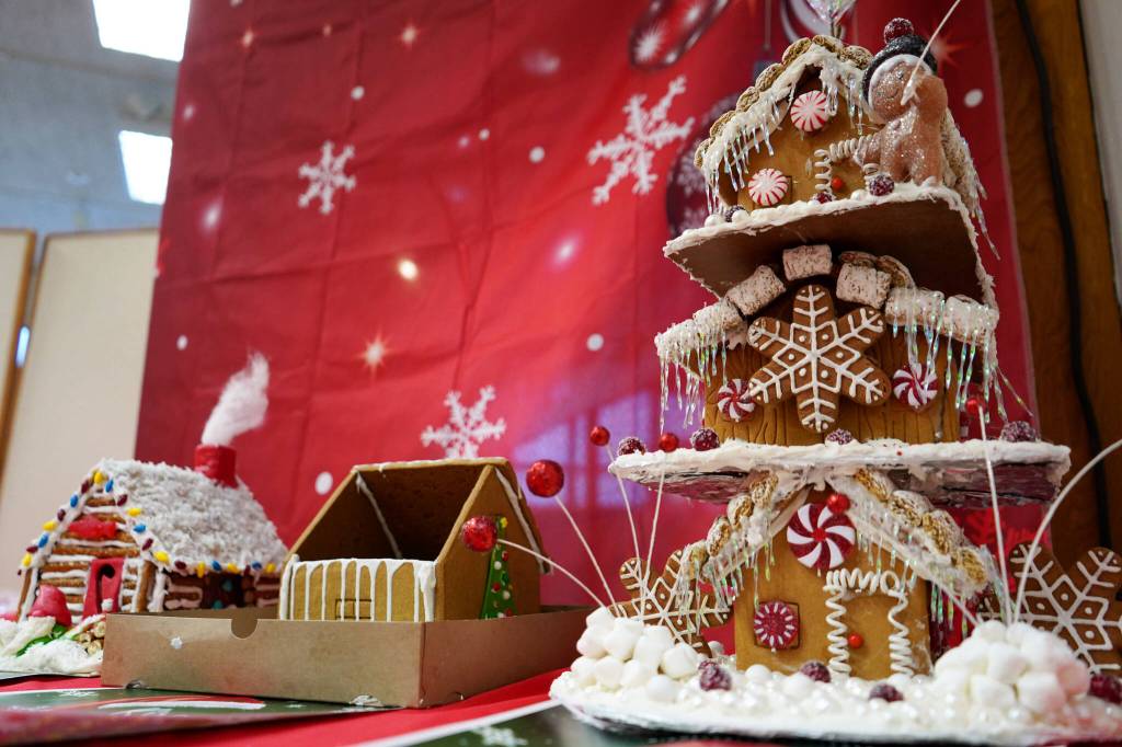 Gingerbread houses constructed by adults Michelle, Kira and Alanna are displayed in the Kenai Chamber of Commerces 12th Annual Gingerbread House Contest at the Kenai Chamber of Commerce and Visitor Center in Kenai, Alaska, on Wednesday, Nov. 20, 2024. (Jake Dye/Peninsula Clarion)