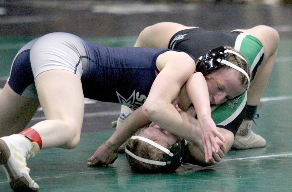 Soldotnas Valarie McAnelly works to pin Colonyճ Tiffany Churchill during the girls 107-pound match in the finals of the Colony Invitational on Saturday, Nov. 23, 2024, at Colony High School in Palmer, Alaska. (Photo by Jeremiah Bartz/Frontiersman)