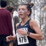 Soldotna's Annie Burns competes in the Division I girls race at the state cross-country running meet on Saturday, Oct. 5, 2024, at Bartlett High School in Anchorage, Alaska. (Photo by Jeff Helminiak/Peninsula Clarion)