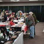 Shoppers browse wares at the 33rd Annual Holiday Bazaar at the Soldotna Regional Sports Complex in Soldotna, Alaska, on Friday, Nov. 22, 2024. (Jonas Oyoumick/Peninsula Clarion)