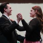 Scott Powell and Hannah Burton, of Soldotna High Schools Grease, rehearse in the Soldotna High School auditorium in Soldotna, Alaska, on Monday, Nov. 25, 2024. (Jake Dye/Peninsula Clarion)