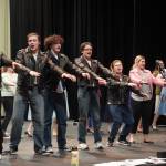 The cast of Soldotna High Schools Grease rehearse in the Soldotna High School auditorium in Soldotna, Alaska, on Monday, Nov. 25, 2024. (Jake Dye/Peninsula Clarion)