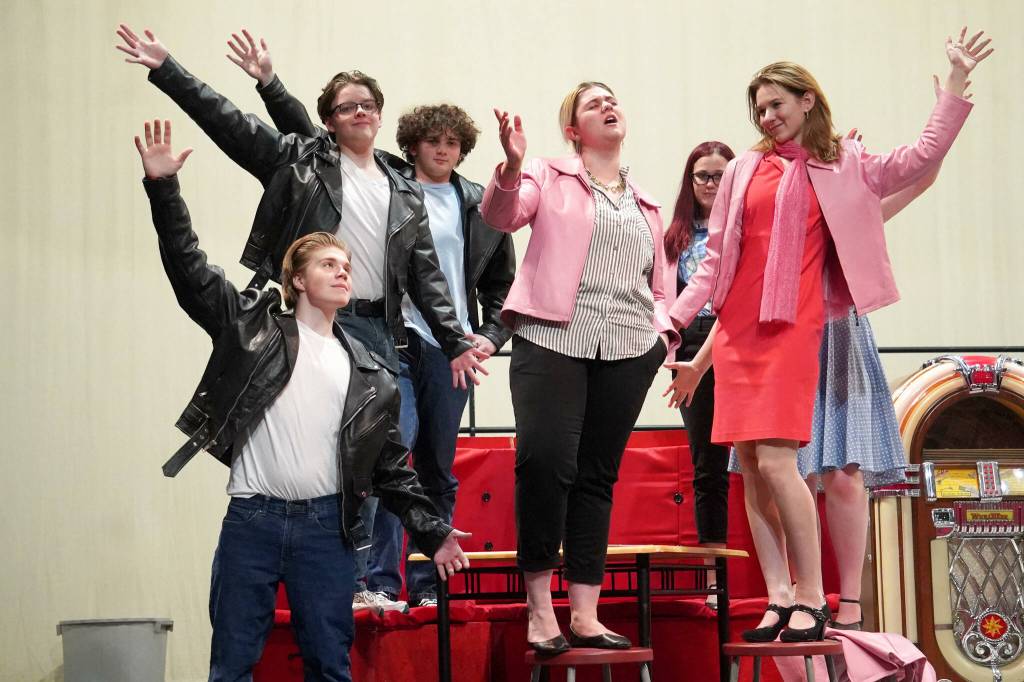 The cast of Soldotna High Schools Grease rehearse in the Soldotna High School auditorium in Soldotna, Alaska, on Monday, Nov. 25, 2024. (Jake Dye/Peninsula Clarion)