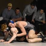 Nikiskis Mason Doth works his way to a pin of Kenai Centrals Leighton Wilshusen on Tuesday, Nov. 26, 2024, at Nikiski Middle-High School in Nikiski, Alaska. (Photo by Jeff Helminiak/Peninsula Clarion)