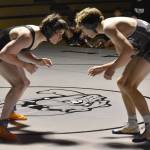 Nikiskis Wyatt Maguire works his way to a pin of Kenai Centrals Conner Cook on Tuesday, Nov. 26, 2024, at Nikiski Middle-High School in Nikiski, Alaska. (Photo by Jeff Helminiak/Peninsula Clarion)