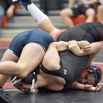 Kenai Centrals Jadeyn Jacko and Soldotnas Mia Hannevold wrestle Tuesday, Dec. 4, 2024, at Kenai Central High School in Kenai, Alaska. (Photo by Jeff Helminiak/Peninsula Clarion)