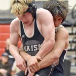 Nikiskis Darren Powell and Soldotnas Mason Bock wrestle Tuesday, Dec. 3, 2024, at Kenai Central High School in Kenai, Alaska. (Photo by Jeff Helminiak/Peninsula Clarion)
