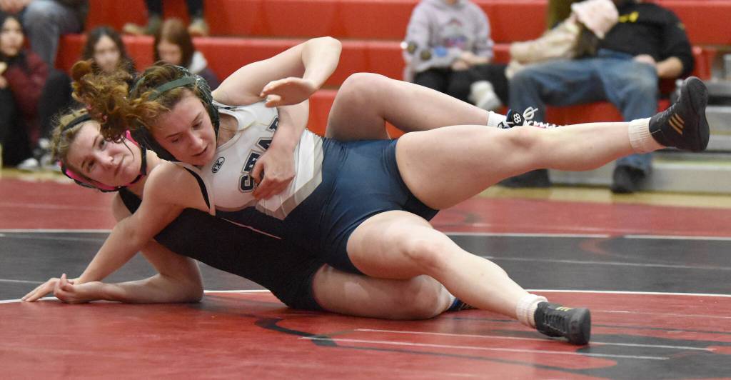 Kenai Centrals Rylee Trent wrestles with Soldotnas Abigail Miller on Tuesday, Dec. 3, 2024, at Kenai Central High School in Kenai, Alaska. (Photo by Jeff Helminiak/Peninsula Clarion)
