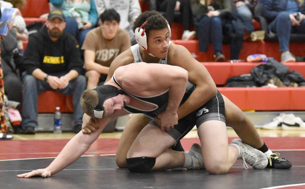 Nikiskis Rex Wittmer and Soldotnas Rodney McNeel wrestle Tuesday, Dec. 3, 2024, at Kenai Central High School in Kenai, Alaska. (Photo by Jeff Helminiak/Peninsula Clarion)