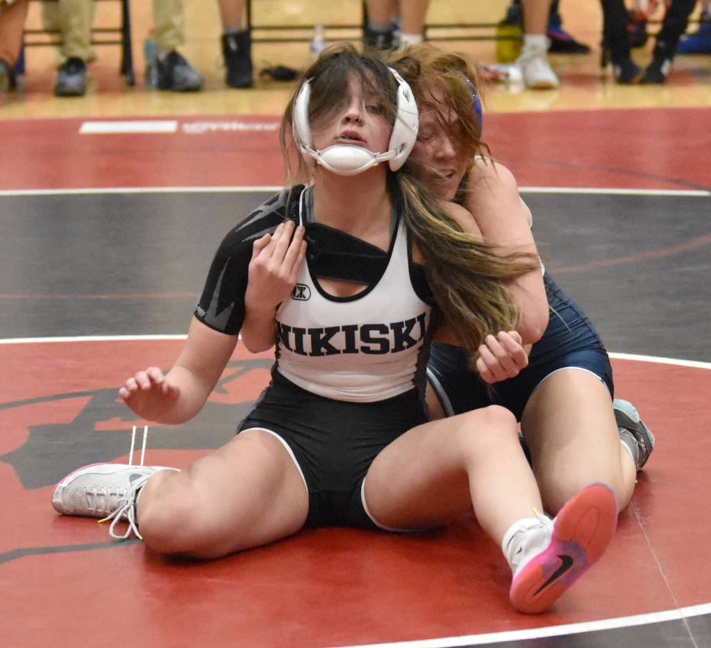Nikiskis Braylynn Young and Soldotnas Rowan Peck wrestle Tuesday, Dec. 3, 2024, at Kenai Central High School in Kenai, Alaska. (Photo by Jeff Helminiak/Peninsula Clarion)