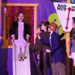 Adelaide Denison, on the slide, and the cast of Nikiski Bulldog Theatres Willy Wonka Jr. rehearse at Nikiski Middle/High School on Tuesday, Dec. 3, 2024. (Jake Dye/Peninsula Clarion)