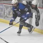 Palmers Bryce Horacek and Soldotnas Marshall DeRaeve battle for the puck Friday, Dec. 6, 2024, at the Soldotna Regional Sports Complex in Soldotna, Alaska. (Photo by Jeff Helminiak/Peninsula Clarion)
