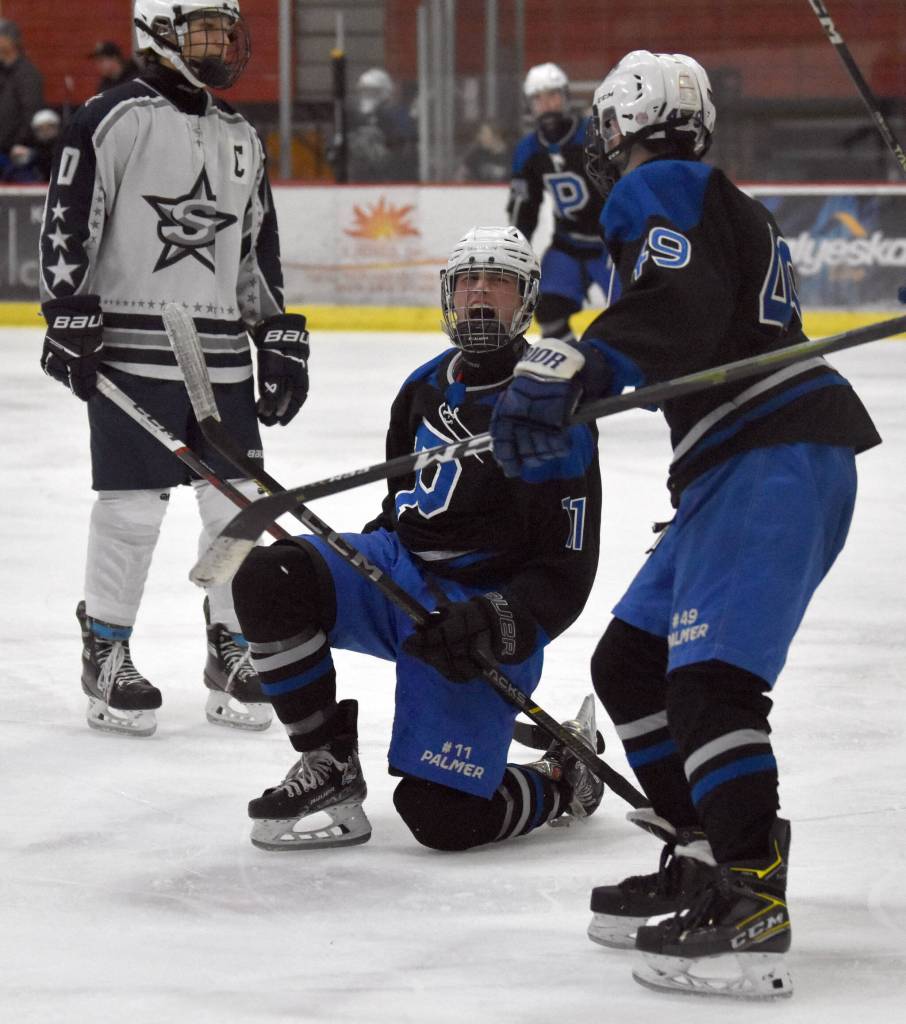 Palmers Jacob Logan celebrates his goal Friday, Dec. 6, 2024, at the Soldotna Regional Sports Complex in Soldotna, Alaska. (Photo by Jeff Helminiak/Peninsula Clarion)