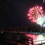 Fireworks explode over the Kenai River at the end of Christmas in the Park at Soldotna Creek Park in Soldotna, Alaska, on Saturday, Dec. 7, 2024. (Jake Dye/Peninsula Clarion)