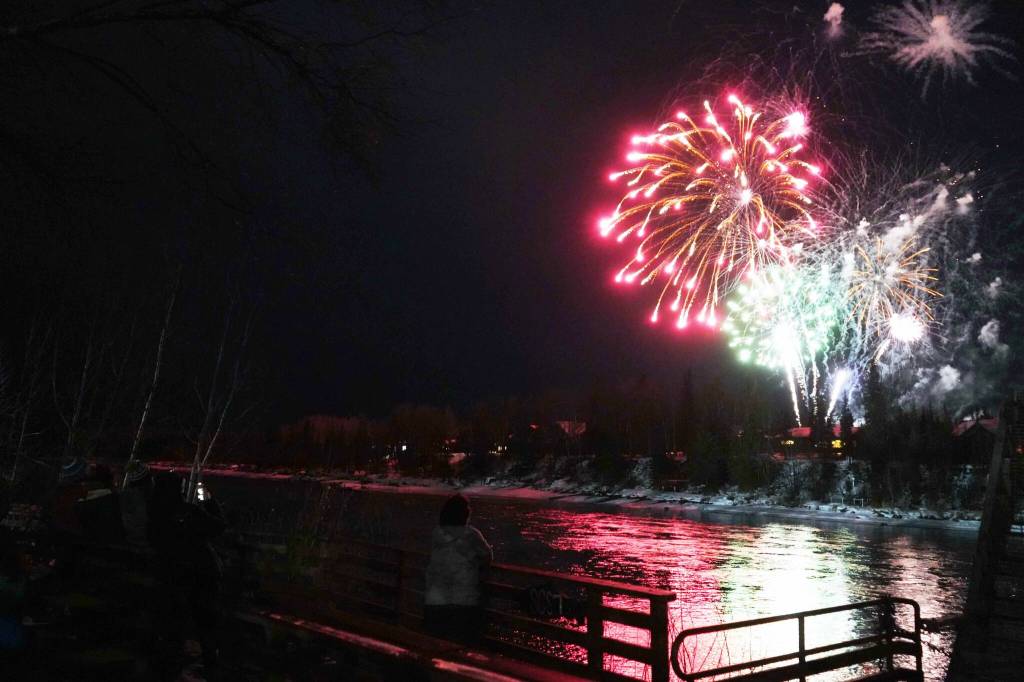 Fireworks explode over the Kenai River at the end of Christmas in the Park at Soldotna Creek Park in Soldotna, Alaska, on Saturday, Dec. 7, 2024. (Jake Dye/Peninsula Clarion)