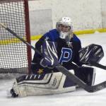 Palmer goalie Mily Christman makes a save Saturday, Dec. 7, 2024, at the Kenai Multi-Purpose Facility in Kenai, Alaska. (Photo by Jeff Helminiak/Peninsula Clarion)