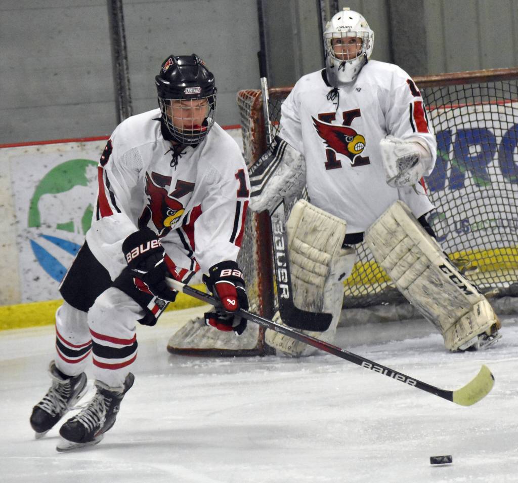 Kenai Centrals Sawyer Vann clears the puck from in front of goalie Seanna Swanson on Thursday, Dec. 12, 2024, at the Kenai Multi-Purpose Facility in Kenai, Alaska. (Photo by Jeff Helminiak/Peninsula Clarion)