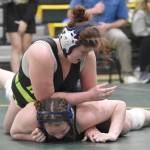 Redingtons Nikayla Miller wrestles to a victory over Homers Araya Andres in the championship match at 185 at the Kachemak Conference wrestling tournament at Seward High School in Seward, Alaska, on Saturday, Dec. 14, 2024. (Photo by Jeff Helminiak/Peninsula Clarion)