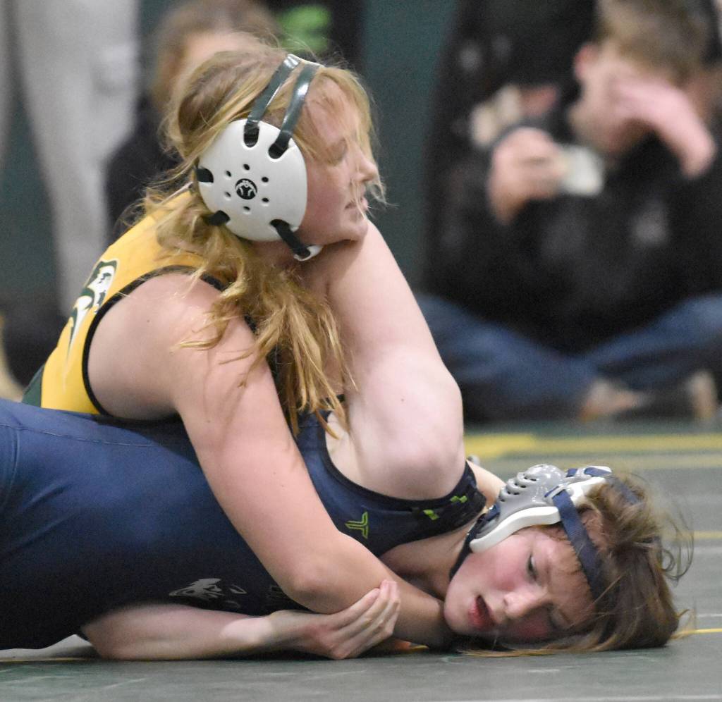 Sewards Alta Liljemark wrestles to a victory over Redingtons Ahna Morphis in the championship match at 152 pounds at the Kachemak Conference wrestling tournament at Seward High School in Seward, Alaska, on Saturday, Dec. 14, 2024. (Photo by Jeff Helminiak/Peninsula Clarion)