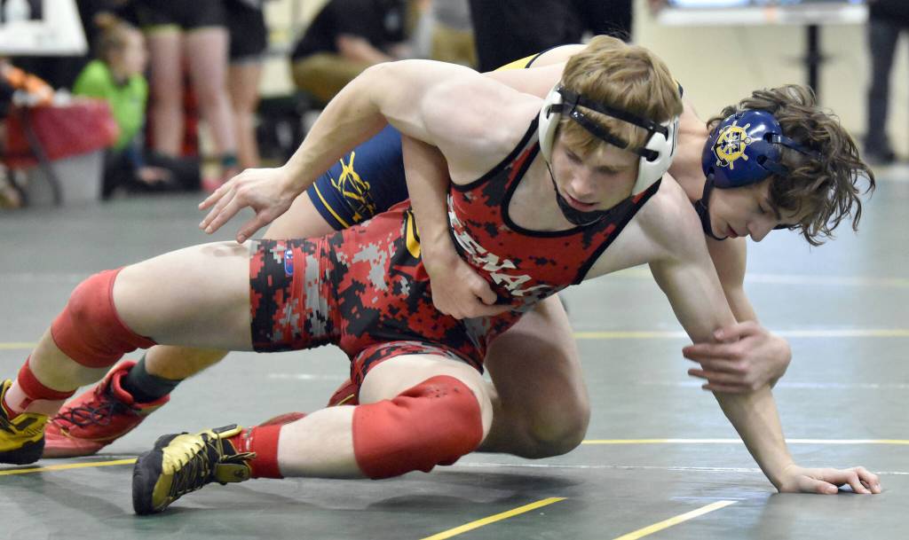 Kenai Centrals Daniel Steffensen wrestles to a victory over Homers Landyn Woods in the championship match at 152 pounds at the Kachemak Conference wrestling tournament at Seward High School in Seward, Alaska, on Saturday, Dec. 14, 2024. (Photo by Jeff Helminiak/Peninsula Clarion)