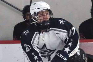 Juneau-Douglas defenseman Carter Miller (6) was tripped into a collision with Soldotna's Keegan Myrick (27) during the Crimson Bears' 2-0 win over the Stars on Saturday, Dec. 14, 2024, at Treadwell Ice Arena in Juneau, Alaska. (Klas Stolpe / Juneau Empire)