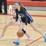 Palmers Loren Nichols dribbles against Kenai Centrals Sierra Hershberger on Thursday, Dec. 19, 2024, at Kenai Central High School in Kenai, Alaska. (Photo by Jeff Helminiak/Peninsula Clarion)