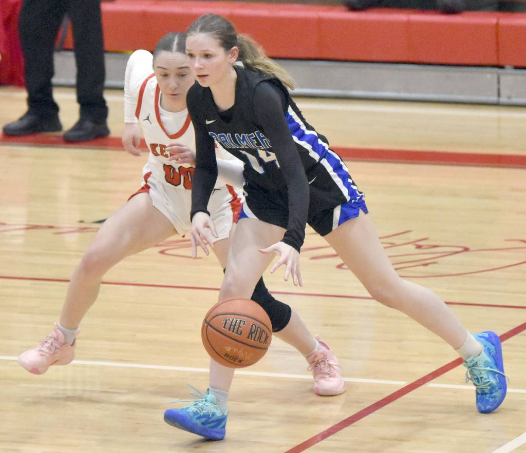Palmers Loren Nichols dribbles against Kenai Centrals Sierra Hershberger on Thursday, Dec. 19, 2024, at Kenai Central High School in Kenai, Alaska. (Photo by Jeff Helminiak/Peninsula Clarion)
