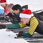 Seward's Marty Fink takes aim at the Candy Cane Scramble on Friday, Dec. 20, 2024, at Tsalteshi Trails just outside of Soldotna, Alaska. (Photo by Jeff Helminiak/Peninsula Clarion)