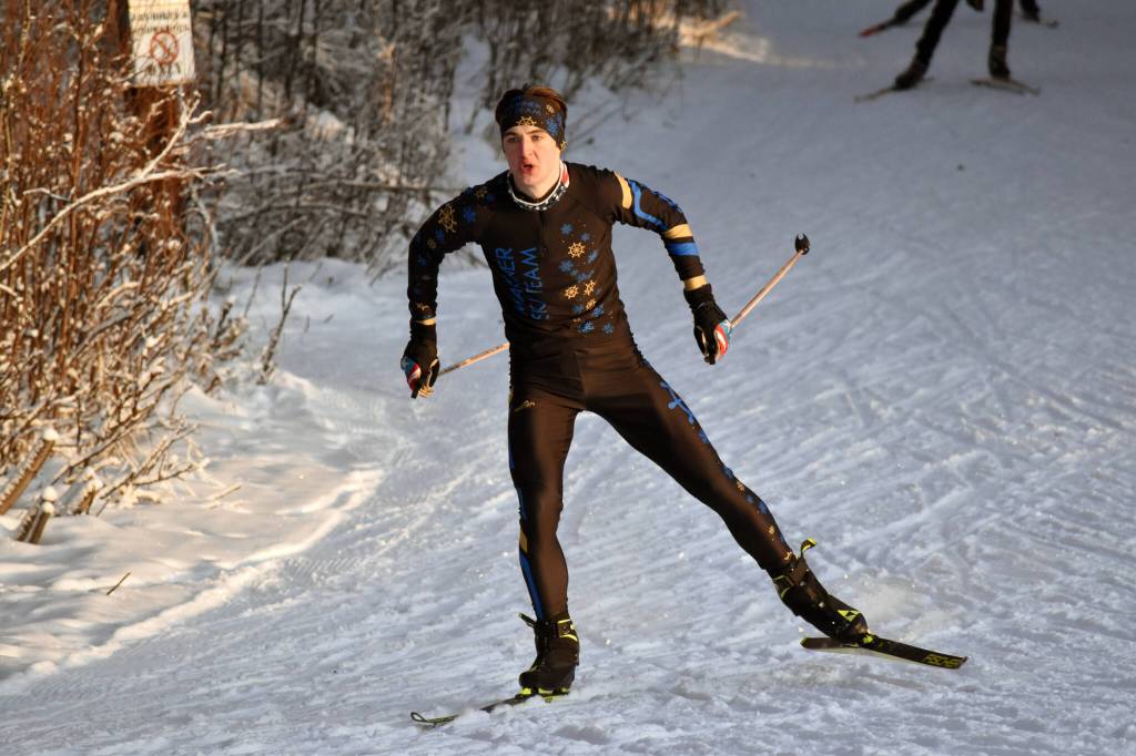 Homer's Leif Jaworski takes the early lead in going on to win the boys race at the Candy Cane Scramble on Friday, Dec. 20, 2024, at Tsalteshi Trails just outside of Soldotna, Alaska. (Photo by Jeff Helminiak/Peninsula Clarion)