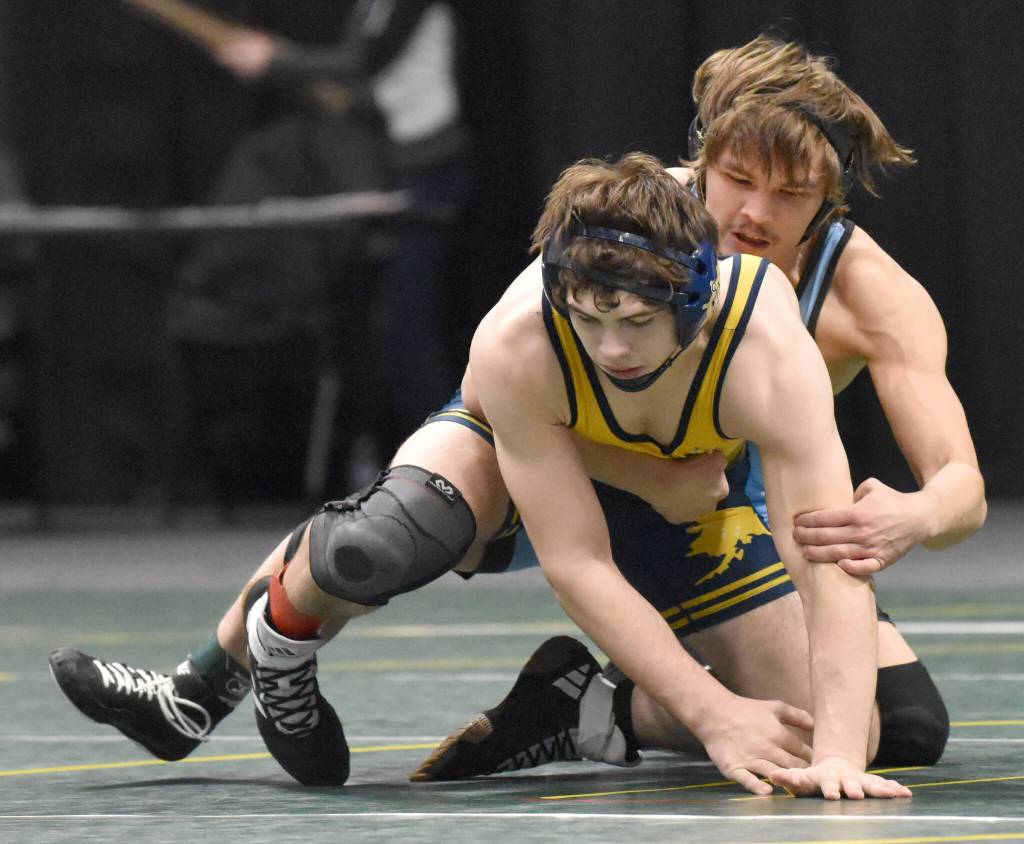 Homers Brayden Woods wrestles to a 7-0 decision over Delen Beck of Valdez in the final at 160 pounds at the Division II state wrestling tournament Saturday, Dec. 21, 2024, at the Alaska Airlines Center in Anchorage, Alaska. (Photo by Jeff Helminiak/Peninsula Clarion)