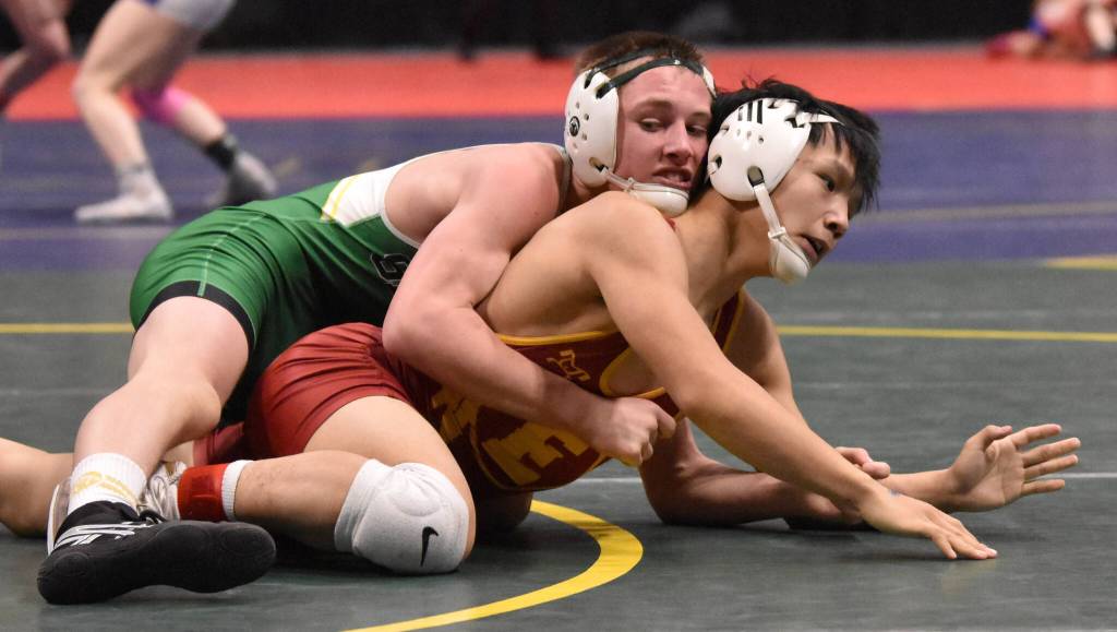 Sewards Ridge Conant wrestles to a technical fall against Mt. Edgecumbes Evan Andrew in the final at 119 pounds at the Division II state wrestling tournament Saturday, Dec. 21, 2024, at the Alaska Airlines Center in Anchorage, Alaska. (Photo by Jeff Helminiak/Peninsula Clarion)