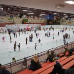 Dozens fill the ice rink during Skate with Santa at the Soldotna Regional Sports Complex in Soldotna, Alaska, on Saturday, Dec. 21, 2024. (Jake Dye/Peninsula Clarion)