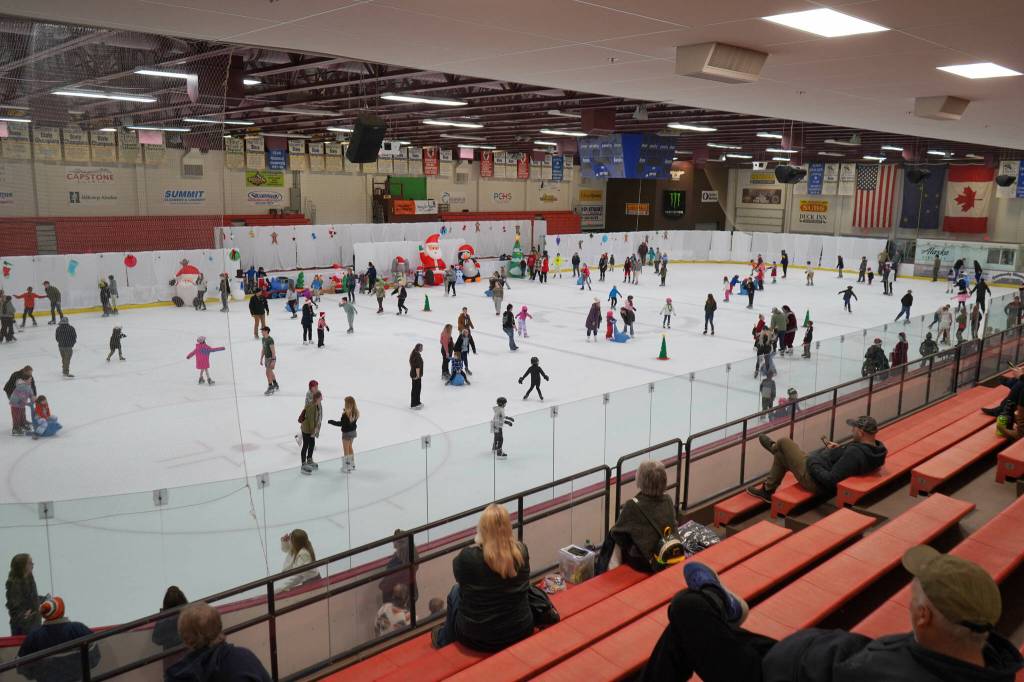 Dozens fill the ice rink during Skate with Santa at the Soldotna Regional Sports Complex in Soldotna, Alaska, on Saturday, Dec. 21, 2024. (Jake Dye/Peninsula Clarion)