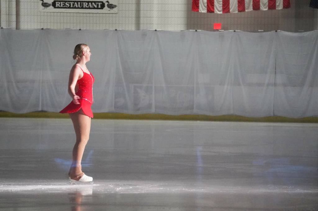 Abygale Shaeffer performs Hallelujah during the 23rd Annual Christmas Lights and Holiday Nights Skating Recital at the Soldotna Regional Sports Complex in Soldotna, Alaska, on Saturday, Dec. 21, 2024. (Jake Dye/Peninsula Clarion)