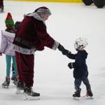 Santa Claus greets children during Skate with Santa at the Soldotna Regional Sports Complex in Soldotna, Alaska, on Saturday, Dec. 21, 2024. (Jake Dye/Peninsula Clarion)