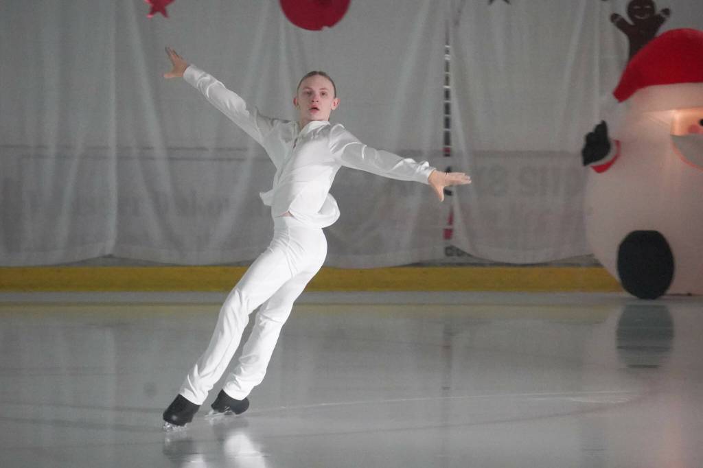Carson Kandas performs Angels in the Snow during the 23rd Annual Christmas Lights and Holiday Nights Skating Recital at the Soldotna Regional Sports Complex in Soldotna, Alaska, on Saturday, Dec. 21, 2024. (Jake Dye/Peninsula Clarion)