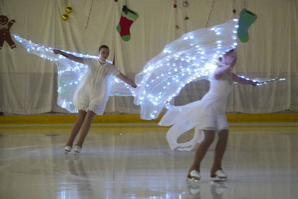 Skaters perform Angels in the Snow during the 23rd Annual Christmas Lights and Holiday Nights Skating Recital at the Soldotna Regional Sports Complex in Soldotna, Alaska, on Saturday, Dec. 21, 2024. (Jake Dye/Peninsula Clarion)