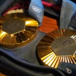 Kristen Faulkners two gold medals from the Paris 2024 Olympics are seen during a meet and greet hosted by the Kenai and Soldotna chambers of commerce at the Cannery Lodge in Kenai, Alaska, on Saturday, Dec. 28, 2024. (Jake Dye/Peninsula Clarion)